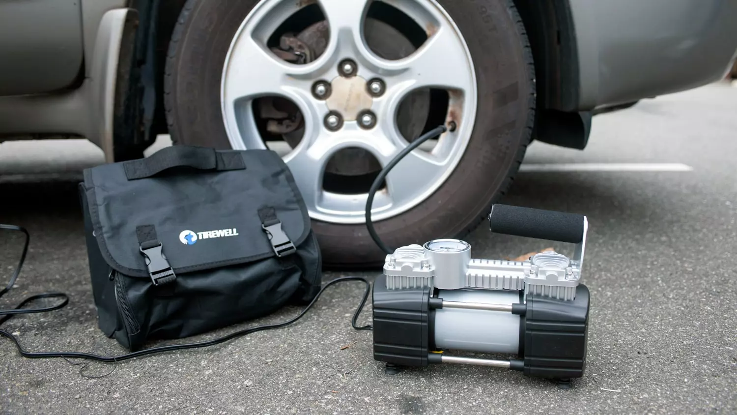 The Tirewell inflator being used on a testing vehicle tire.