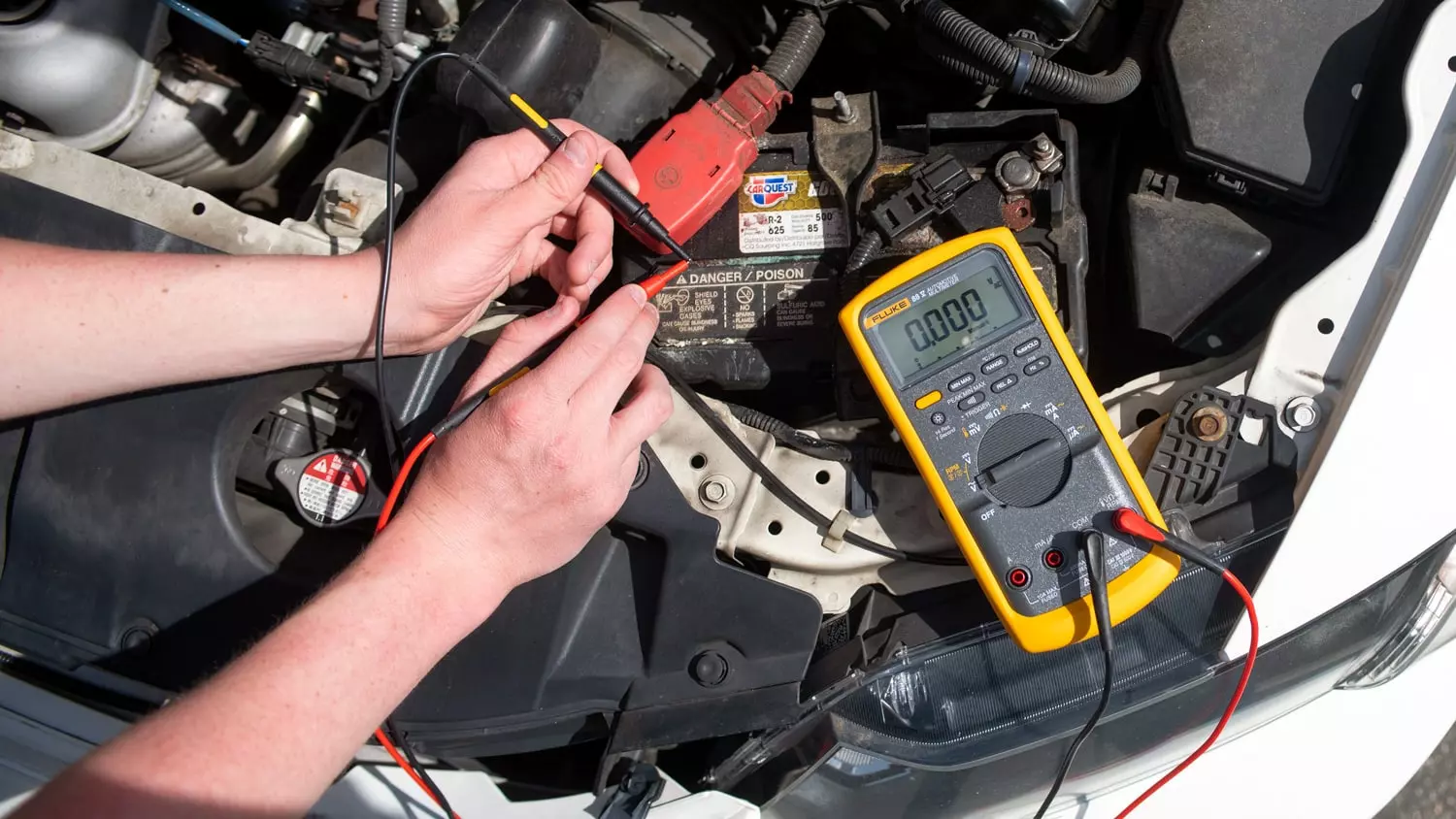 The Fluke 88V being used to measure voltage, current, and other electric components in a vehicle.