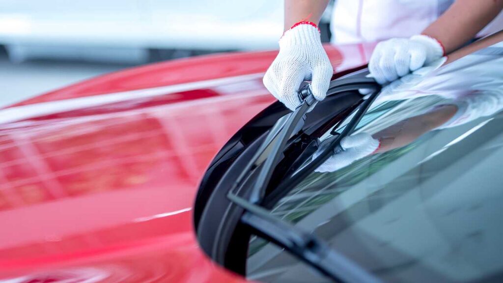 The mechanic is changing the wipers
